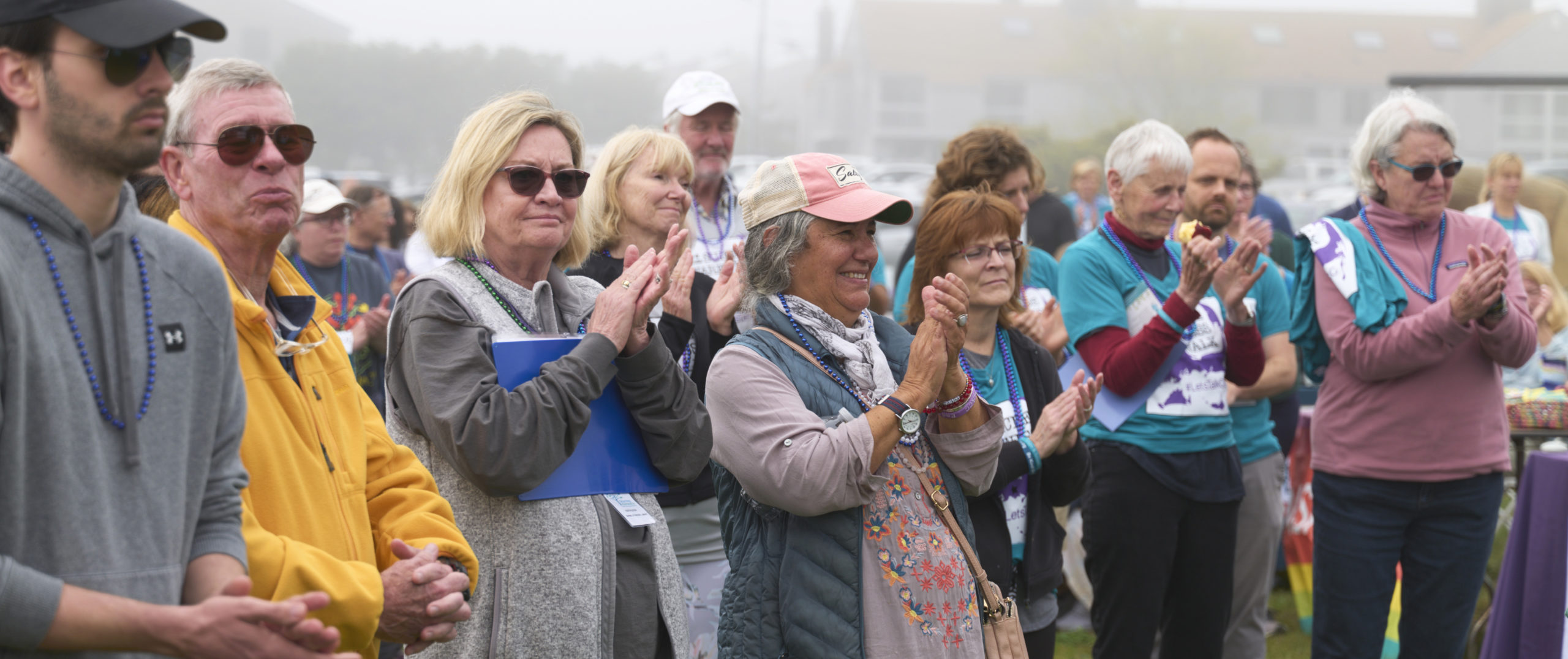 A crowd of people clapping and cheering at the 2022 Cape & Islands Suicide Awareness Walk